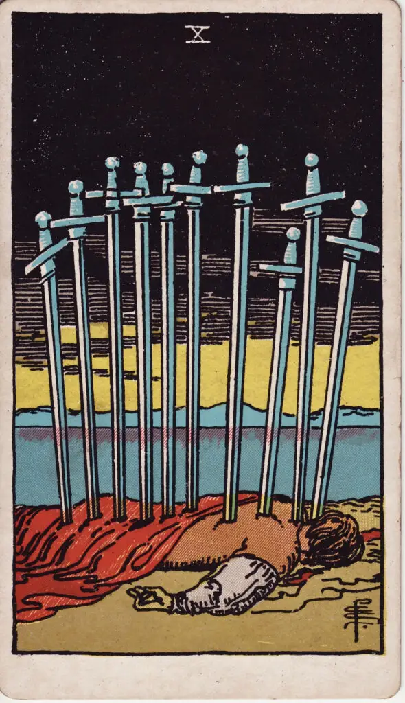 Illustration du Dix d’Épées du tarot Rider Waite : un corps gît au sol, transpercé par dix épées dans le dos, sous un ciel sombre ; au loin, l’horizon commence à s’éclaircir.